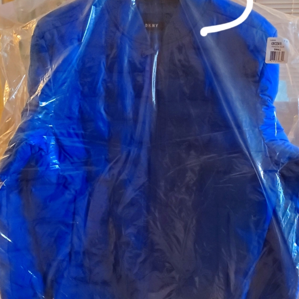 Brand new DKNY mens puffer coat size small.